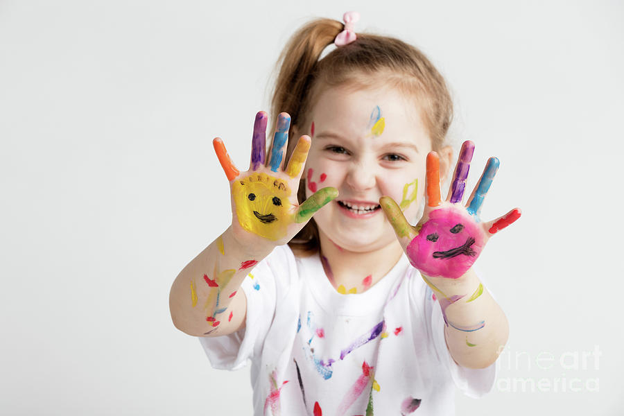 A girl showing her colorful painted hands Photograph by Michal Bednarek