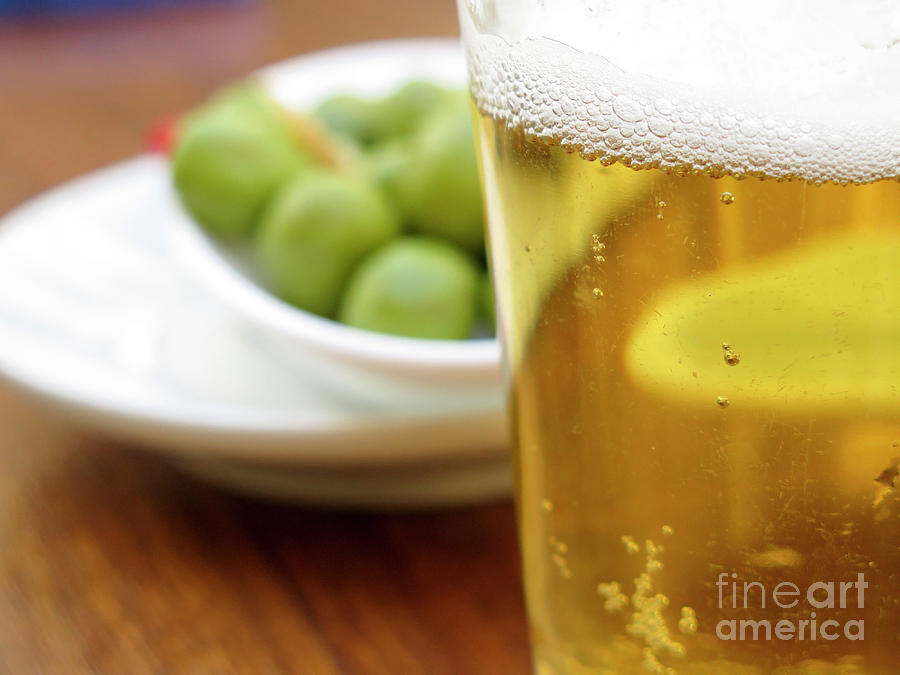 A glass of beer and olives Photograph by Ami Siano