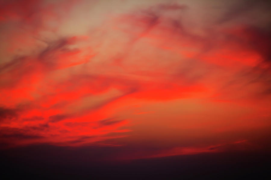 a gorgeous sunset with luminous red clouds over the Yala Nationalpark Photograph by Gina Koch