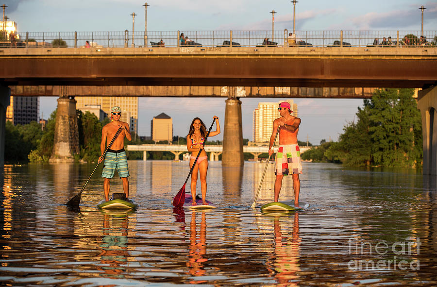 Sup Photograph - A group of friends navigate Lady Bird Lake in Austin Texas the Stand Up Paddle SUP Capital of the world by Dan Herron