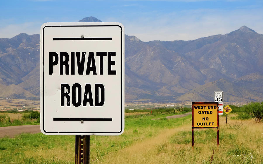 A Group of Signs Along a Road Photograph by Derrick Neill - Fine Art ...