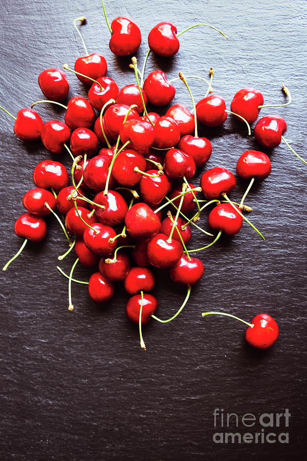 A handful of cherries on the slate platter Photograph by Marina Usmanskaya