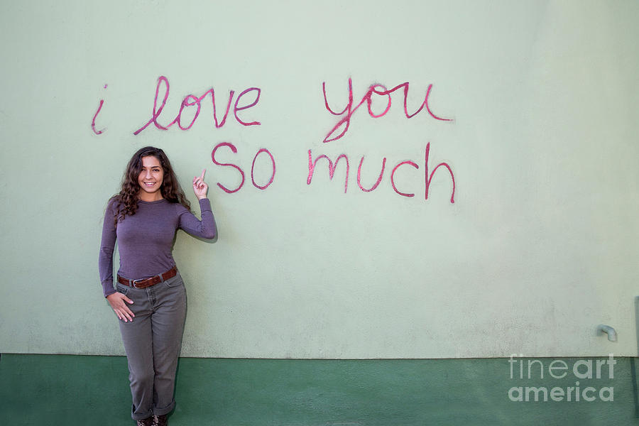 Austin Photograph - A local Austin woman poses in front of the iconic I Love You So  by Dan Herron