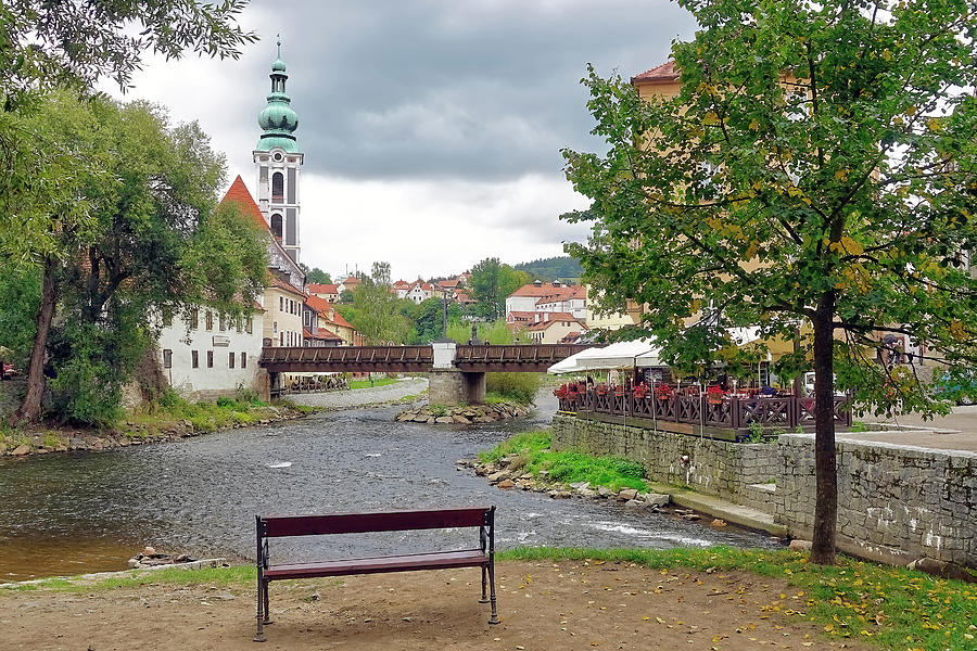 A Lone Park Bench Along The Banks Of The Vltava River In The Czech Republic Photograph by Rick Rosenshein