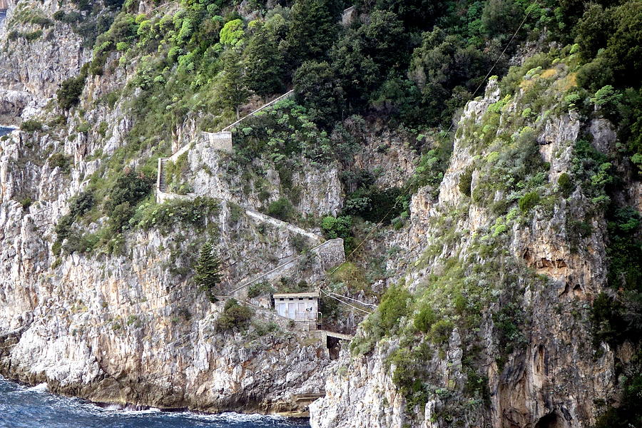 A Long Range View Of Stairs Leading Down To Dwellings The Overlook The Sea On The Amalfi Coast In It Photograph by Rick Rosenshein