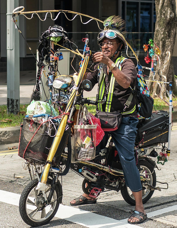 A man and his bike Photograph by Jocelyn Kahawai