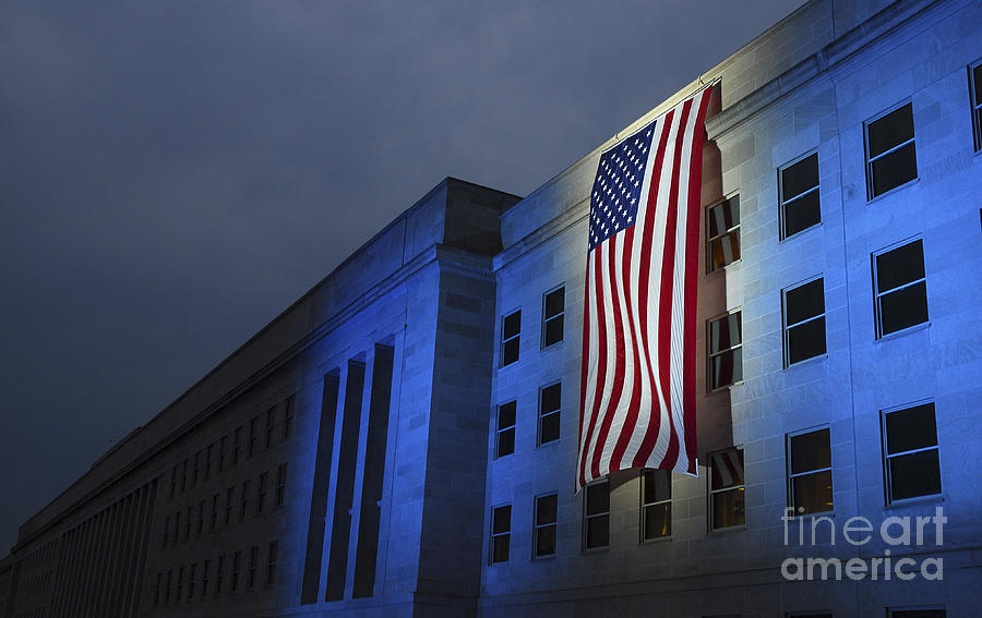 Architecture Photograph - A Memorial Flag Is Illuminated On The by Stocktrek Images