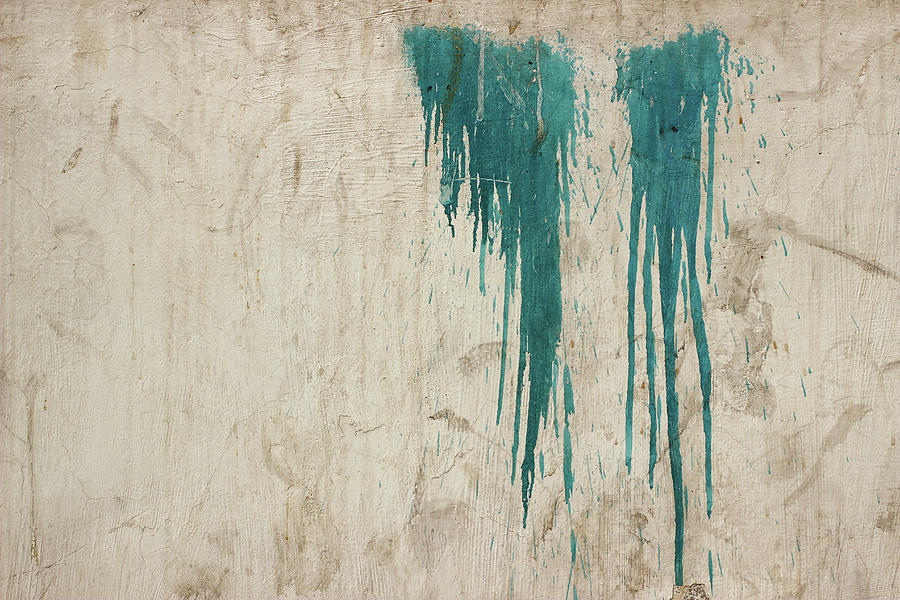 A minimalist photo of Two patches of dripping blue paint on a textured Indian wall Photograph by Prakash Ghai