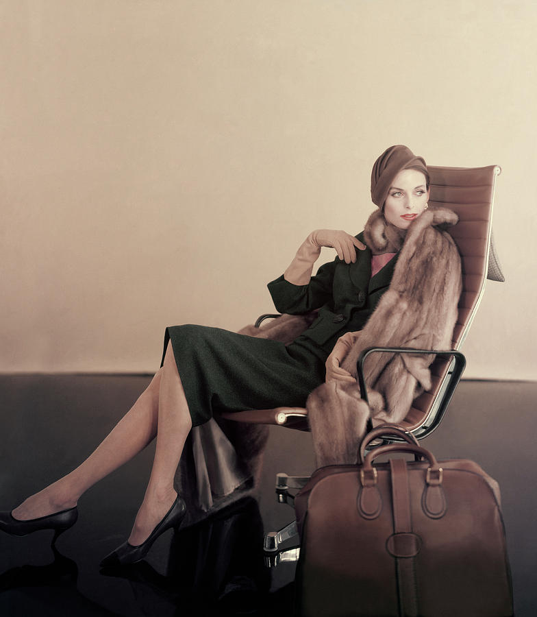 Hat Photograph - A Model In An Eames Chair by Karen Radkai