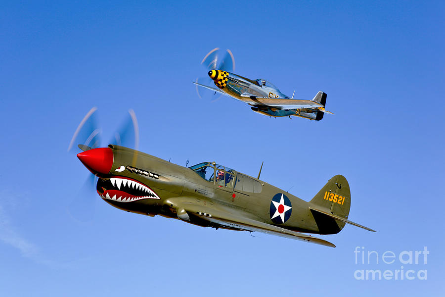 Transportation Photograph - A P-40e Warhawk And A P-51d Mustang by Scott Germain