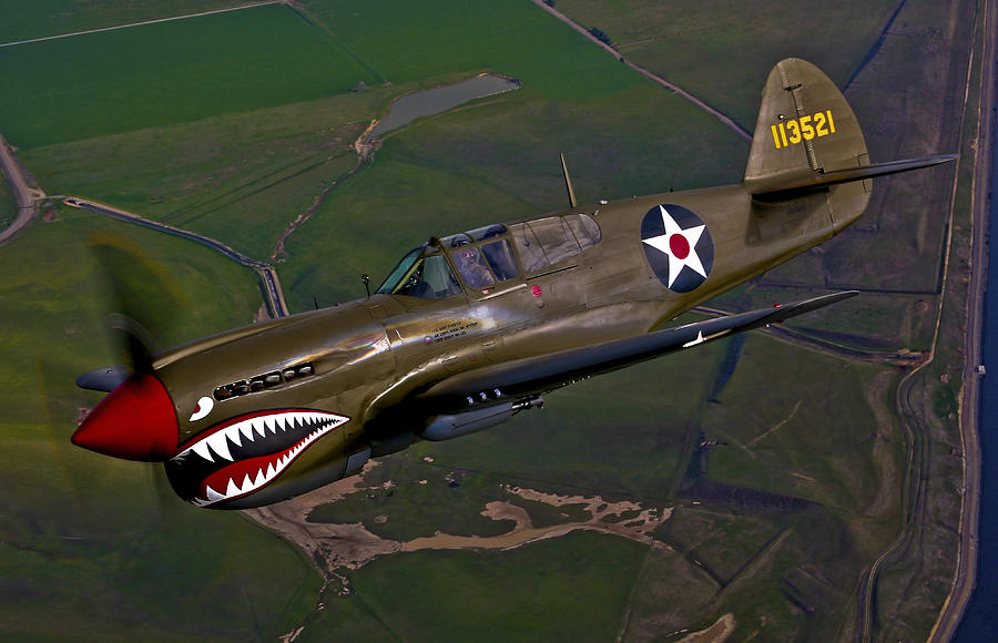 A P-40e Warhawk In Flight Photograph by Scott Germain