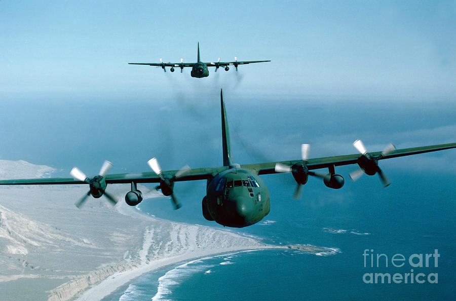 Airplane Photograph - A Pair Of C-130 Hercules In Flight by Stocktrek Images
