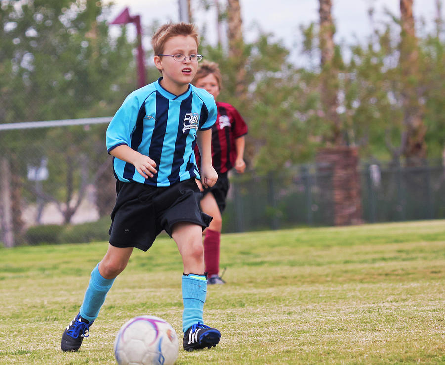 A Pair of Youth Soccer Players Compete Photograph by Derrick Neill - Pixels