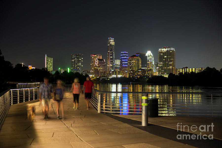 Austin Skyline Photograph - A perfect night for a stroll and take the dog for a walk on the Board Walk Trail Bridge on Lady Bird Lake with Austin Skyline backdrop by Dan Herron