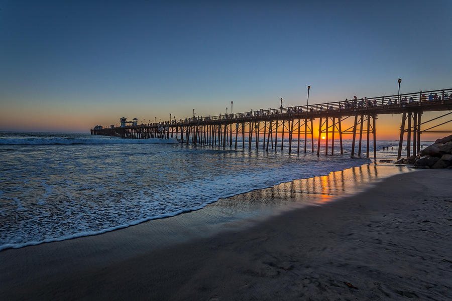 Sunset Photograph - A Piers to be Last Light by Peter Tellone