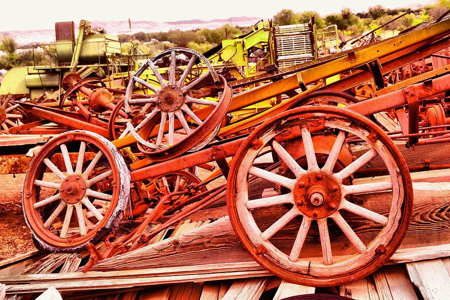 A Pile Of Three Old Wheels Photograph