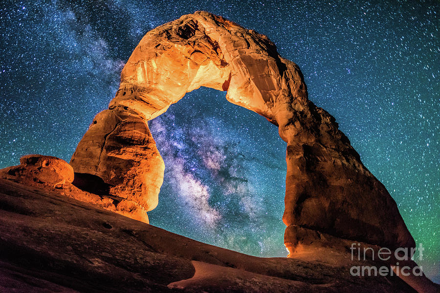 A Portal to the Milky Way at Delicate Arch Photograph by Robert Loe