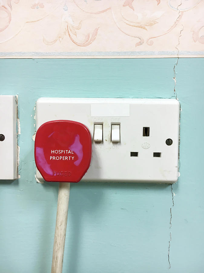 A red plug Photograph by Tom Gowanlock