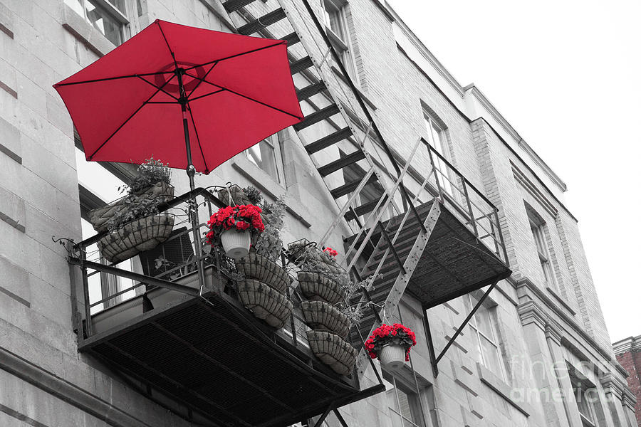 A red umbrella on a balcony Photograph by Agnes Caruso