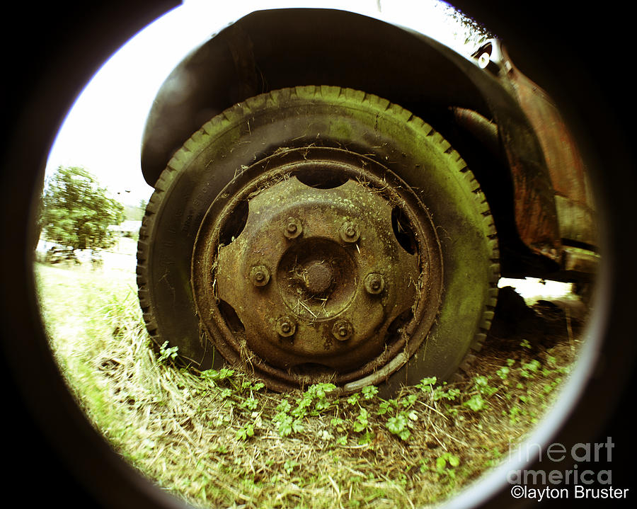 A Rolling Tire Gathers No Moss Photograph by Clayton Bruster