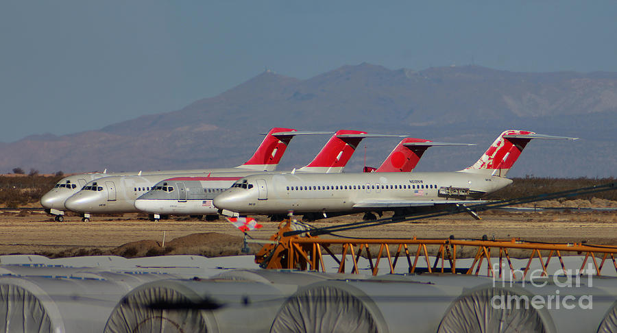 A Row of DC-9s Silently Await their Final Demise Photograph by Wernher Krutein