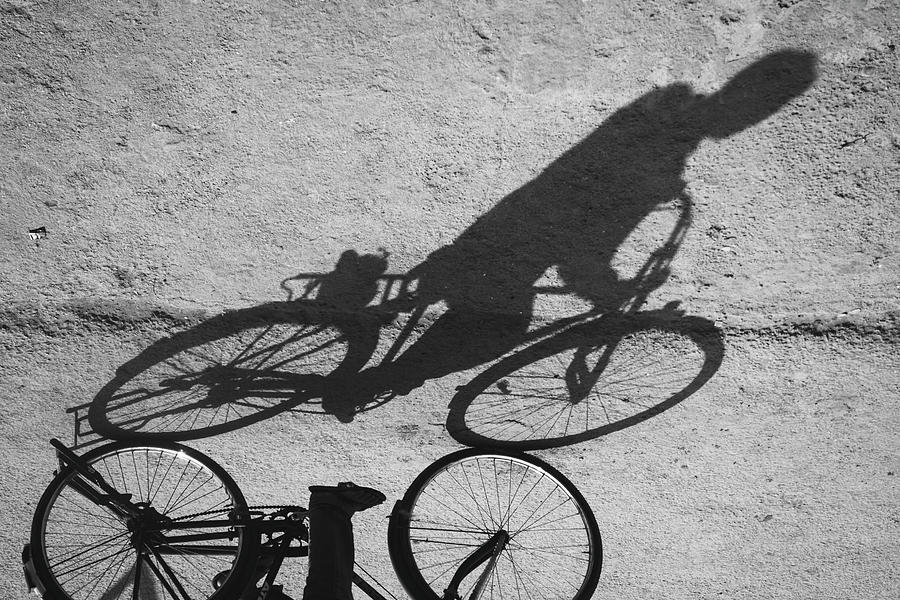 A Shadow Riding A Bike Photograph