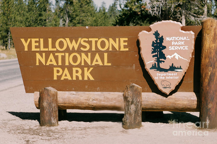 A sign at the south entrance to Yellowstone National Park, Wyoming circa 1960 Photograph by Monterey County Historical Society