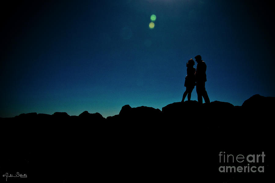 A Silhouetted Couples Magic Moment Photograph