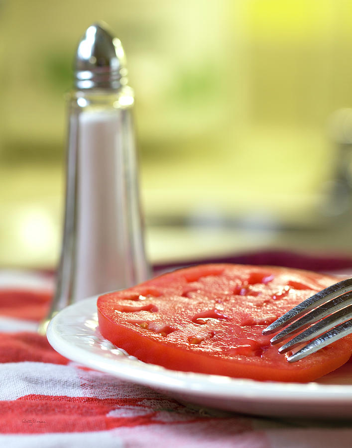 Tomato Photograph - A Slice of Beefsteak Tomato with Salt by Betty Denise