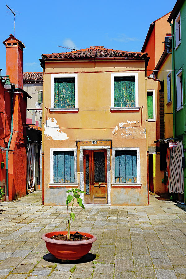 A Small Courtyard On The Island Of Burano, Italy Photograph by Rick Rosenshein