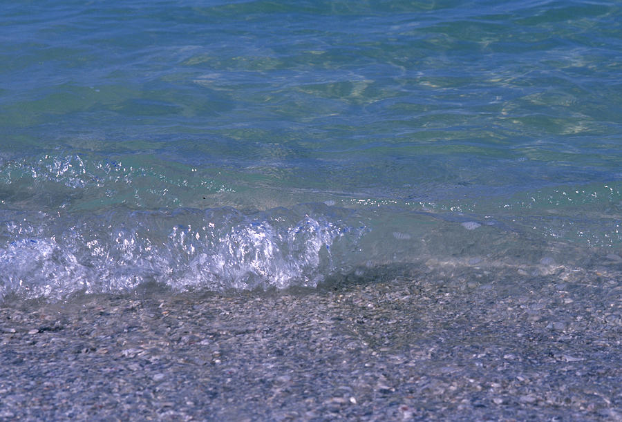 A Small Wave Ripples Onto Shore Photograph by Stacy Gold