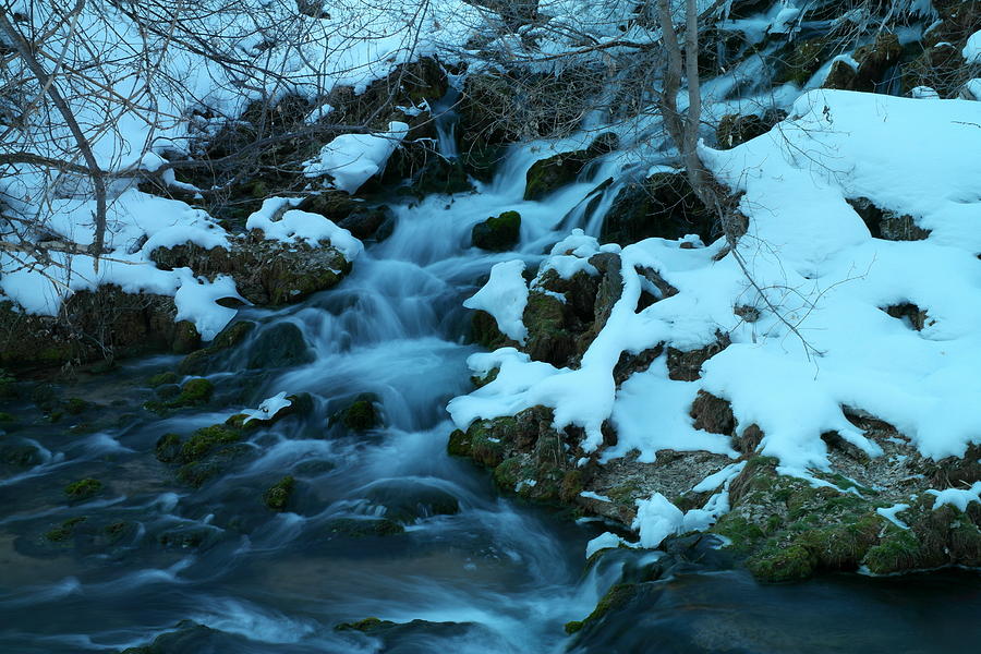 A snowy stream Photograph by Jeff Swan