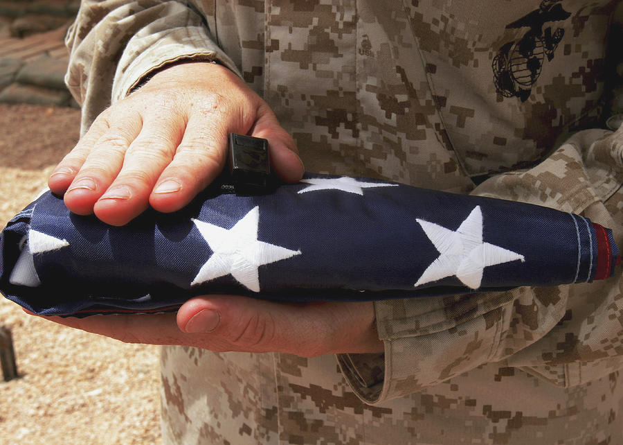 A Soldier Holds The United States Flag Photograph by Stocktrek Images
