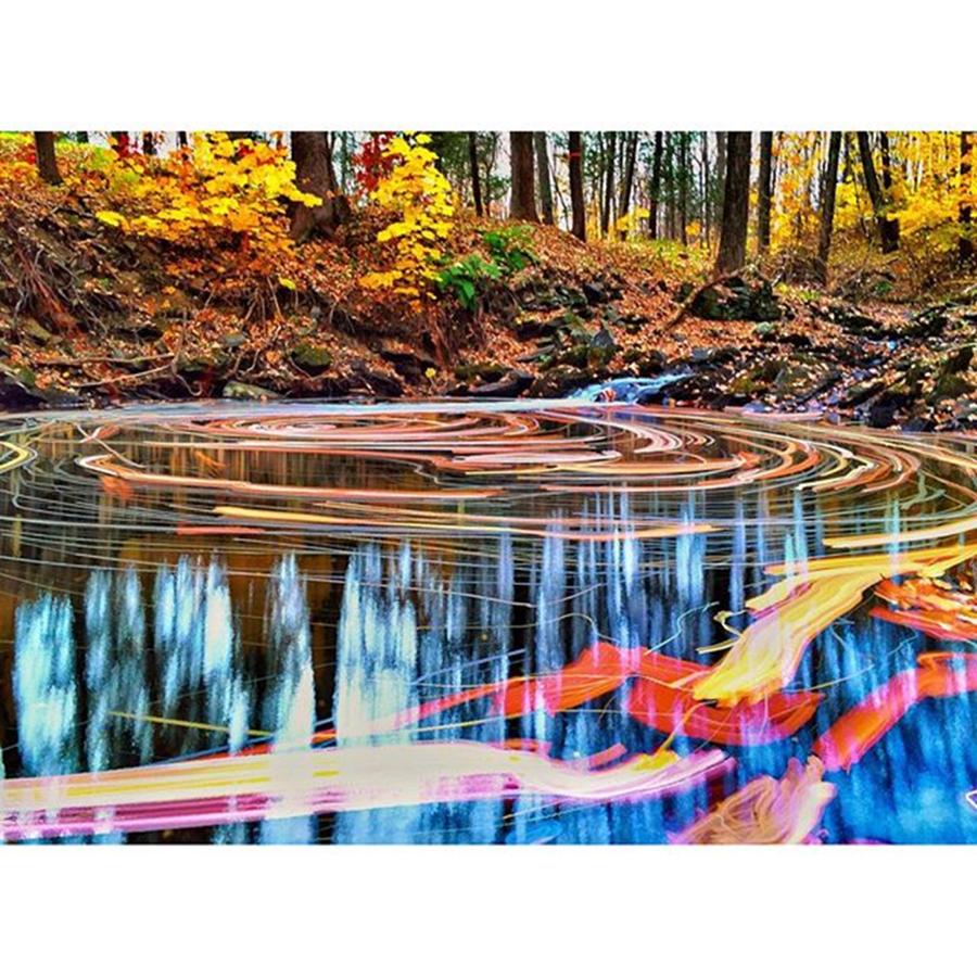 Fall Photograph - Leaves Swirl Quuckly on a Woodland Pond  by Blake Butler