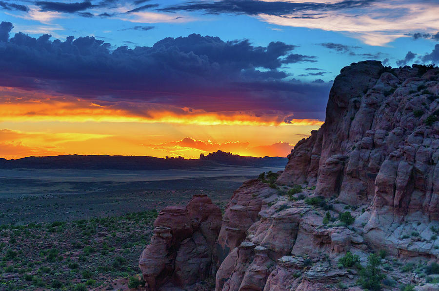 A Sunset In Arches National Park Photograph by John De Bord