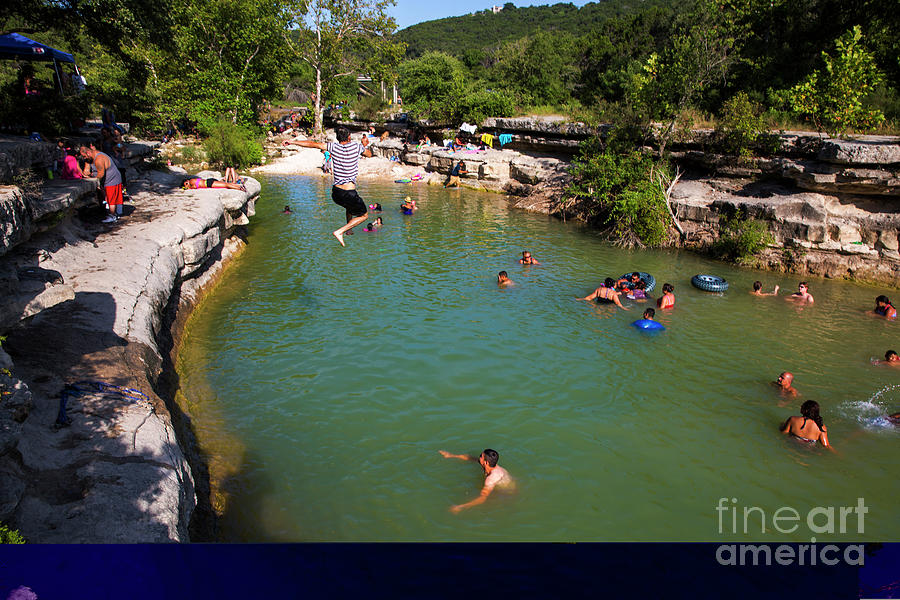 Austin Photograph - A swimmer leaps off the cliff at Bull Creek District Park, known as Austins best swimming hole by Dan Herron