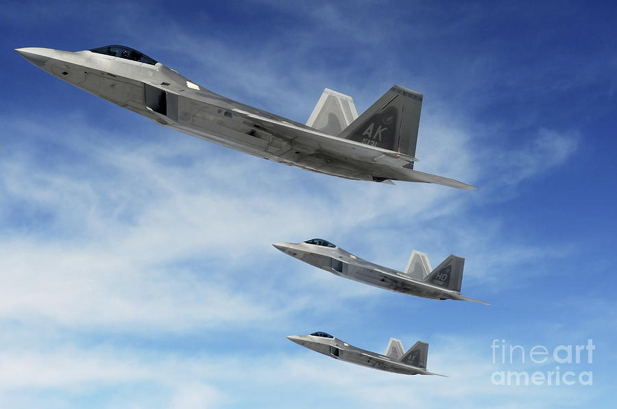 Airplane Photograph - A Three-ship Formation Of F-22 Raptors by Stocktrek Images