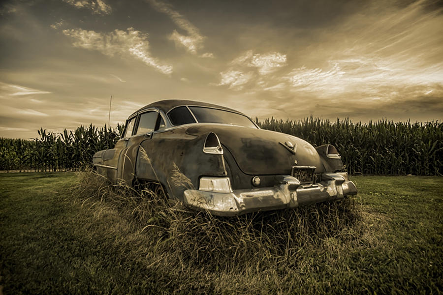 A tinted photo of rusty caddy by a cornfield  Photograph by Sven Brogren