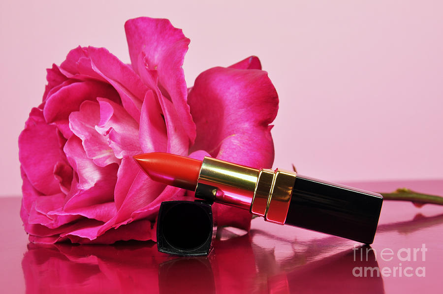 A touch of femininity with a bright red luxury lipstick Photograph by Milleflore Images