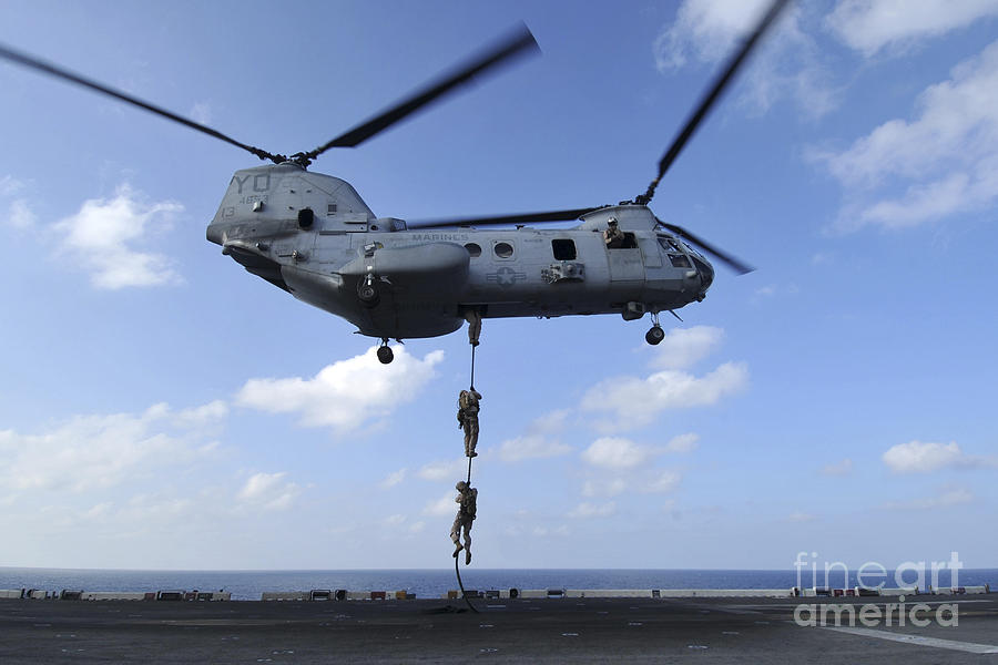 A Trio Of Marines Fast Rope Photograph by Stocktrek Images