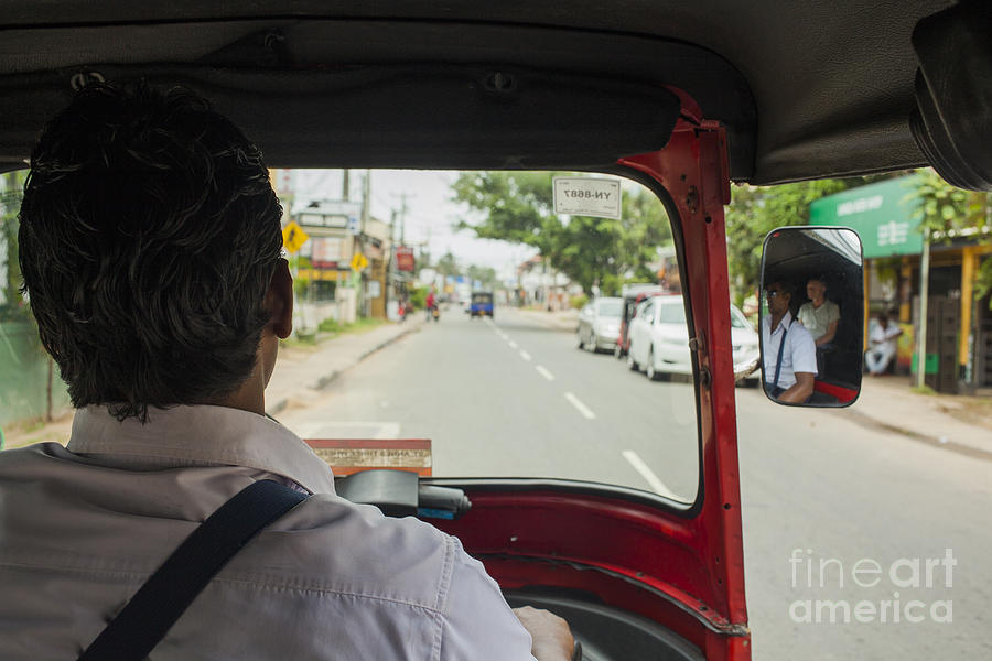 A tuk tuk driver on the road Photograph by Patricia Hofmeester