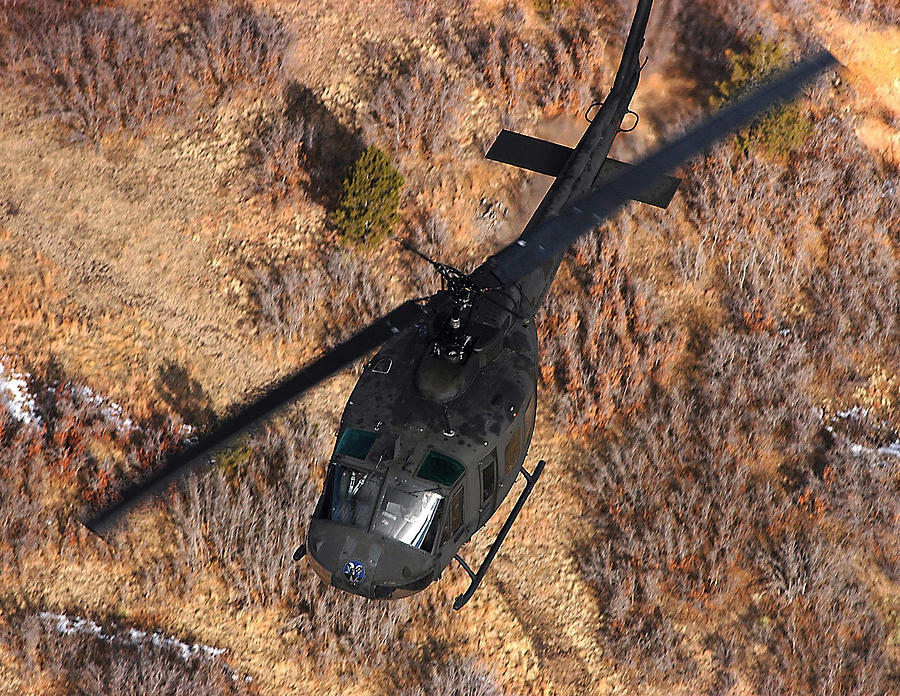 A Uh-1 Huey In Flight Photograph by Stocktrek Images