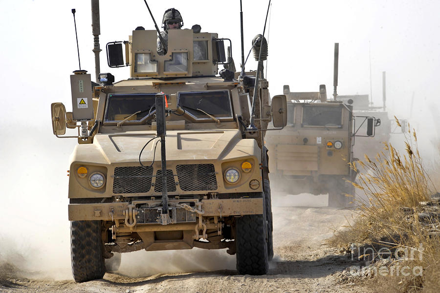 A U.s. Army M-atv Leads A Convoy Photograph by Stocktrek Images