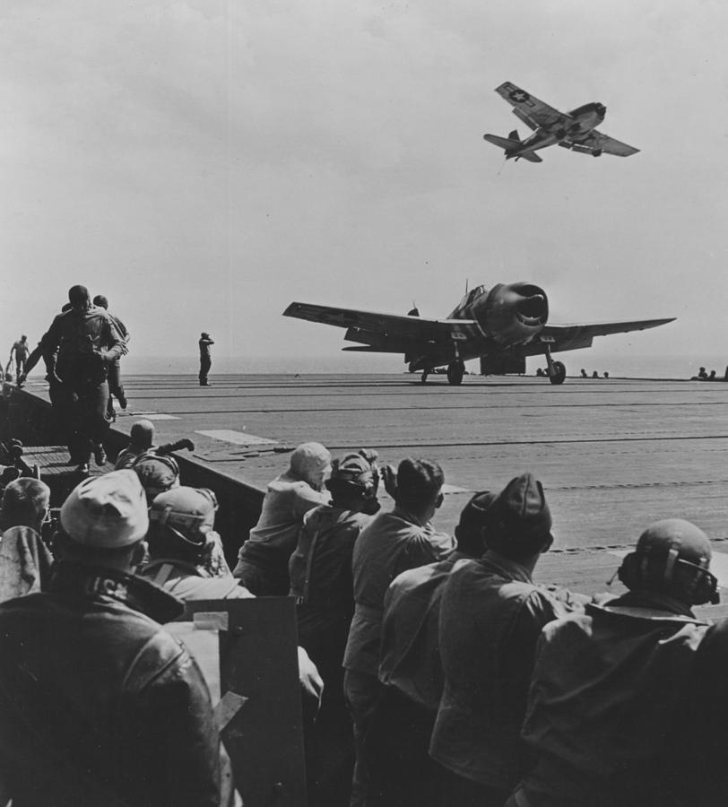 Jet Photograph - A US Navy Hellcat Fighter Aircraft Landing On The Deck Of A Carrier by American School