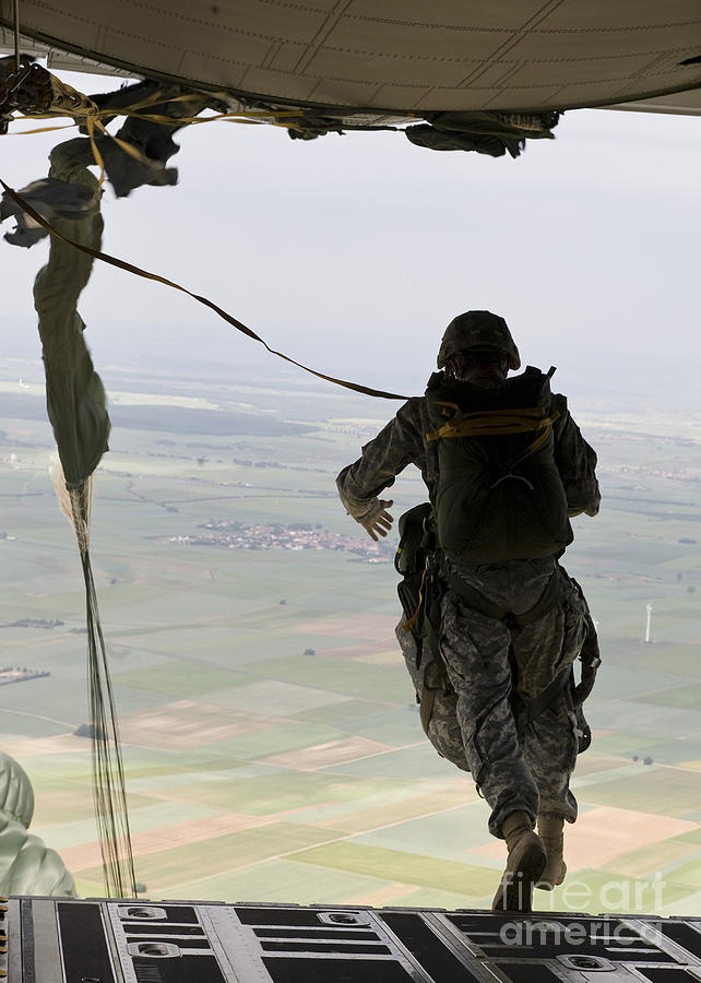 A U.s. Soldier Jumps Out Of A C-130j Photograph by Stocktrek Images ...