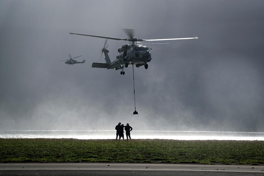 a vertical replenishment with an SH-60 Sea Hawk helicopter Painting by ...