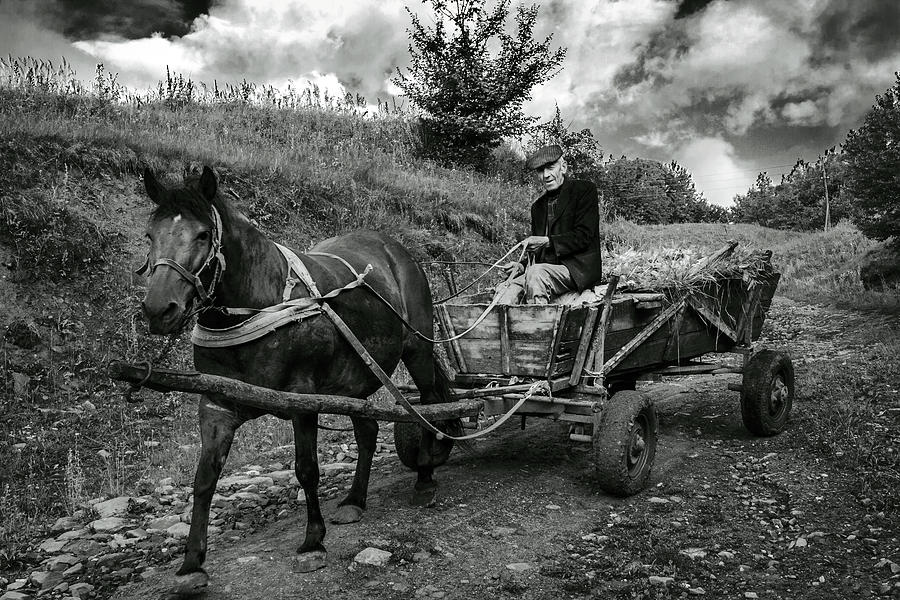 Black And White Photograph - A Villager With His Horse and Cart, Ukraine by Yuri Lev