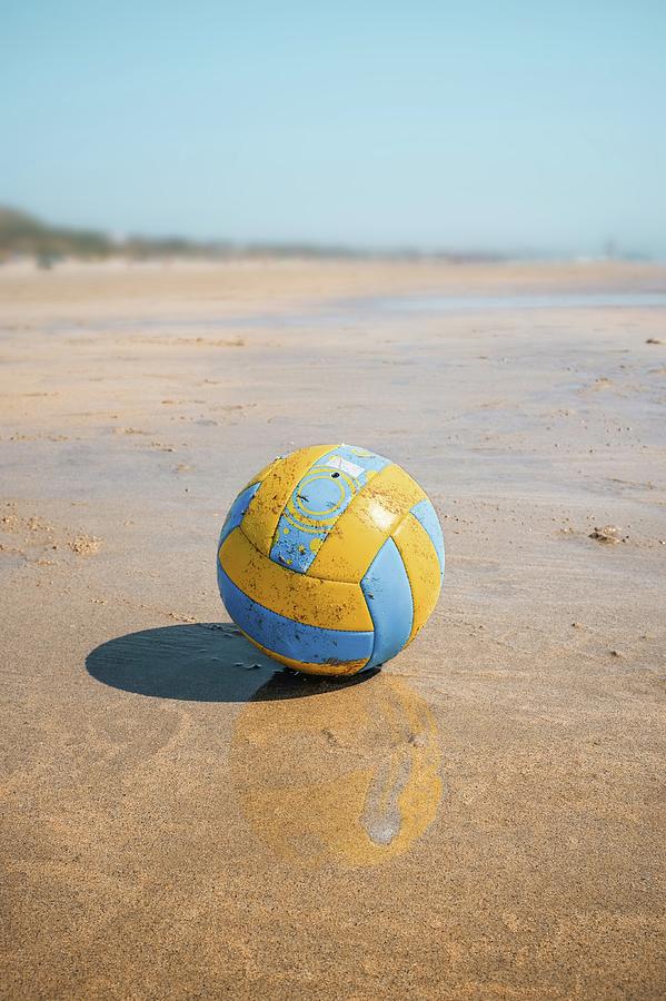 A volleyball on the beach Photograph by Carlos Caetano