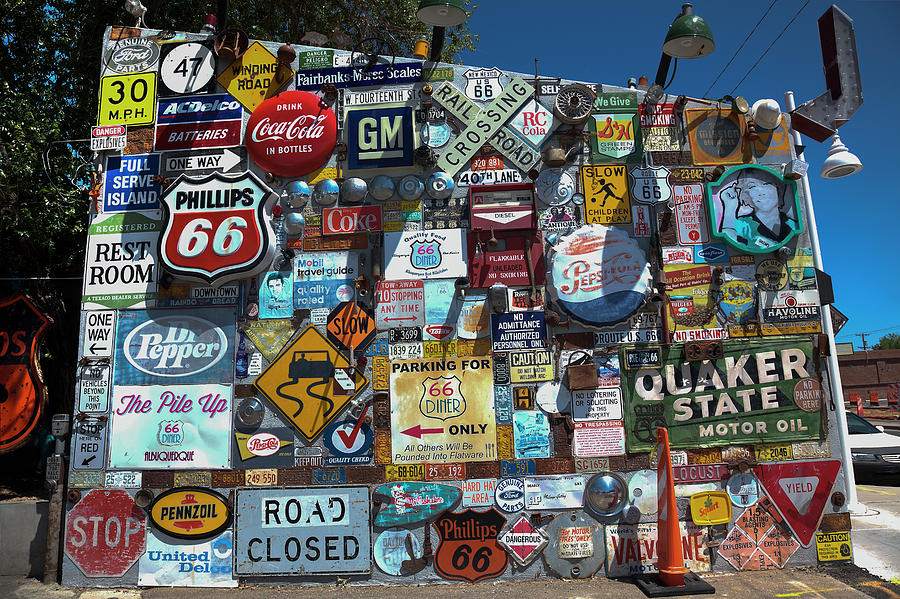 A wall of signs Photograph by Steve Gravano