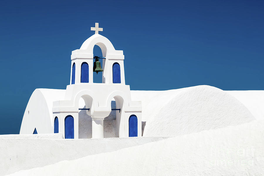 A white church with blue elements in Oia on Santorini island, Greece. Photograph by Michal Bednarek